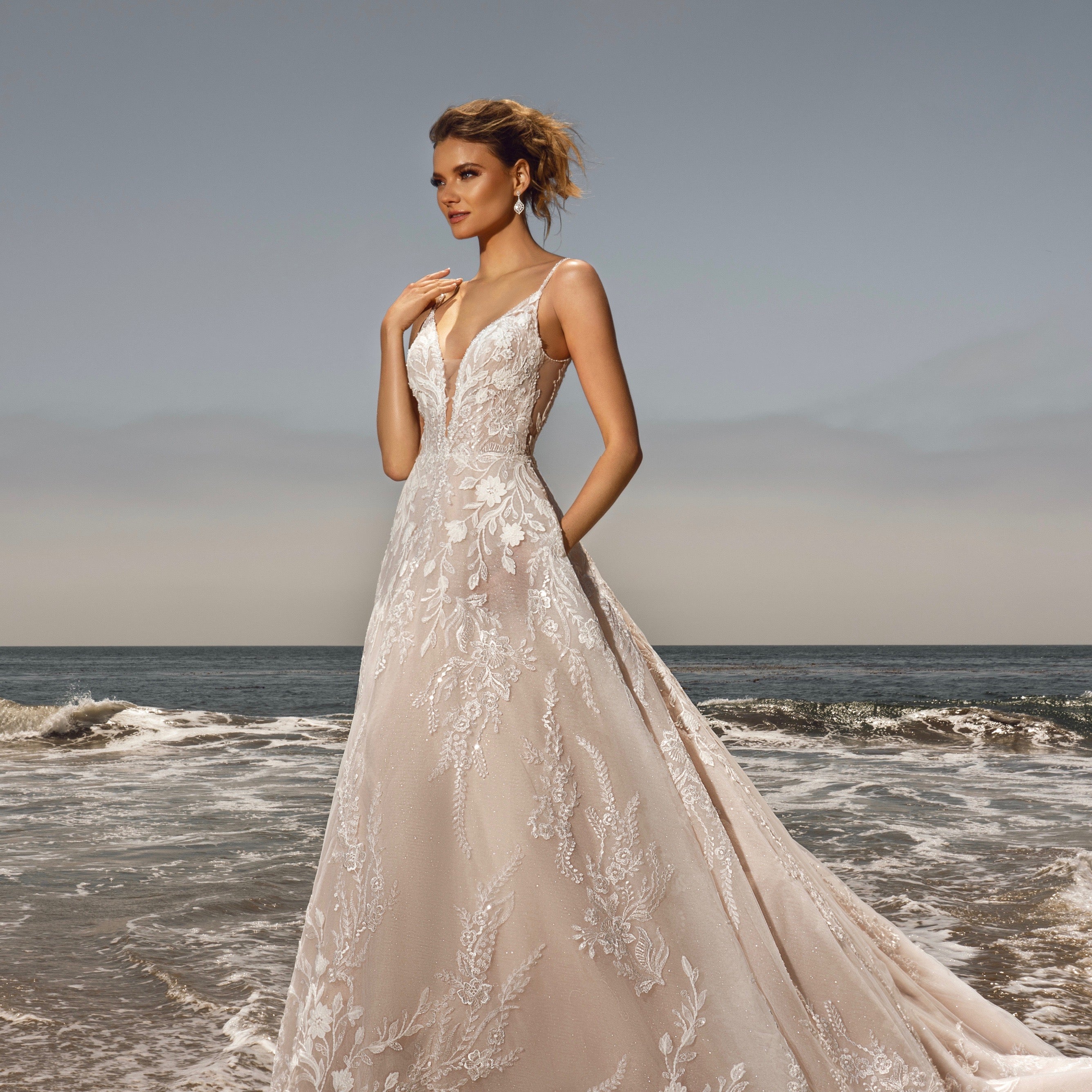 Chana Cubic Zirconia Dangle Earrings from Anna Bellagio. Model Bride is wearing a Bridal Gown From Kitty Chen Couure at the Beach.