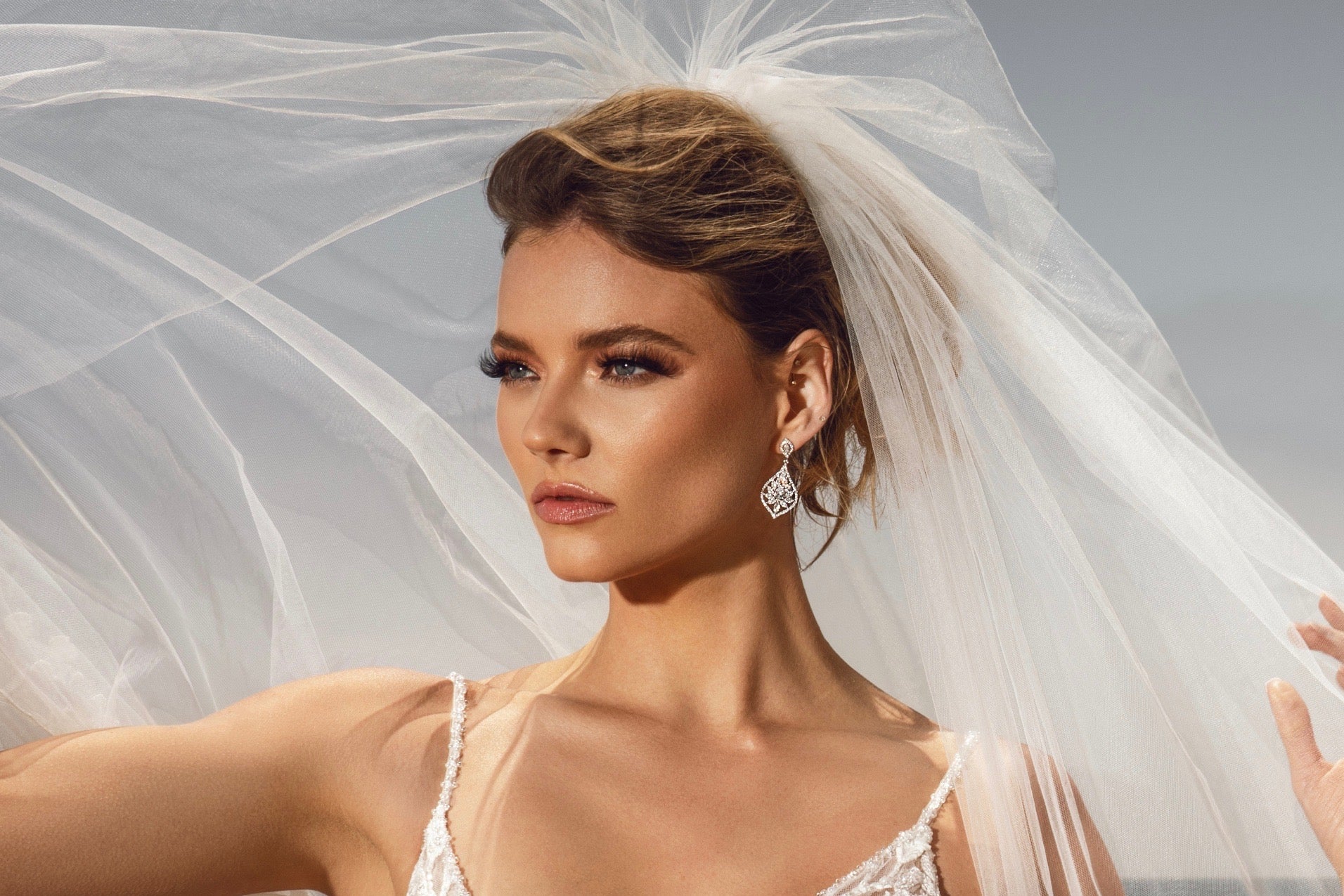 Chana Cubic Zirconia Dangle Earrings from Anna Bellagio. Model Bride is wearing a Kitty Chen Gown and Veil