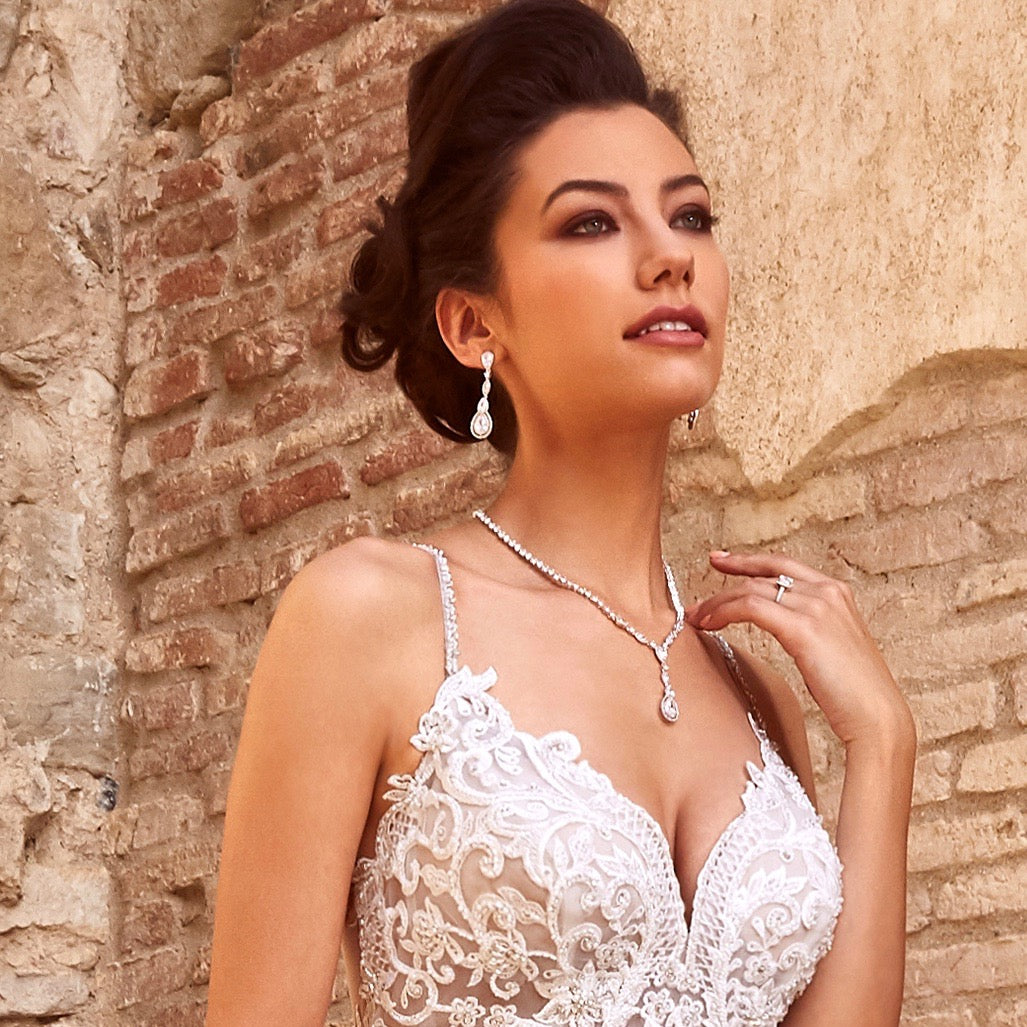 Airelle Cubic Zirconia Necklace on a model near a brick wall.