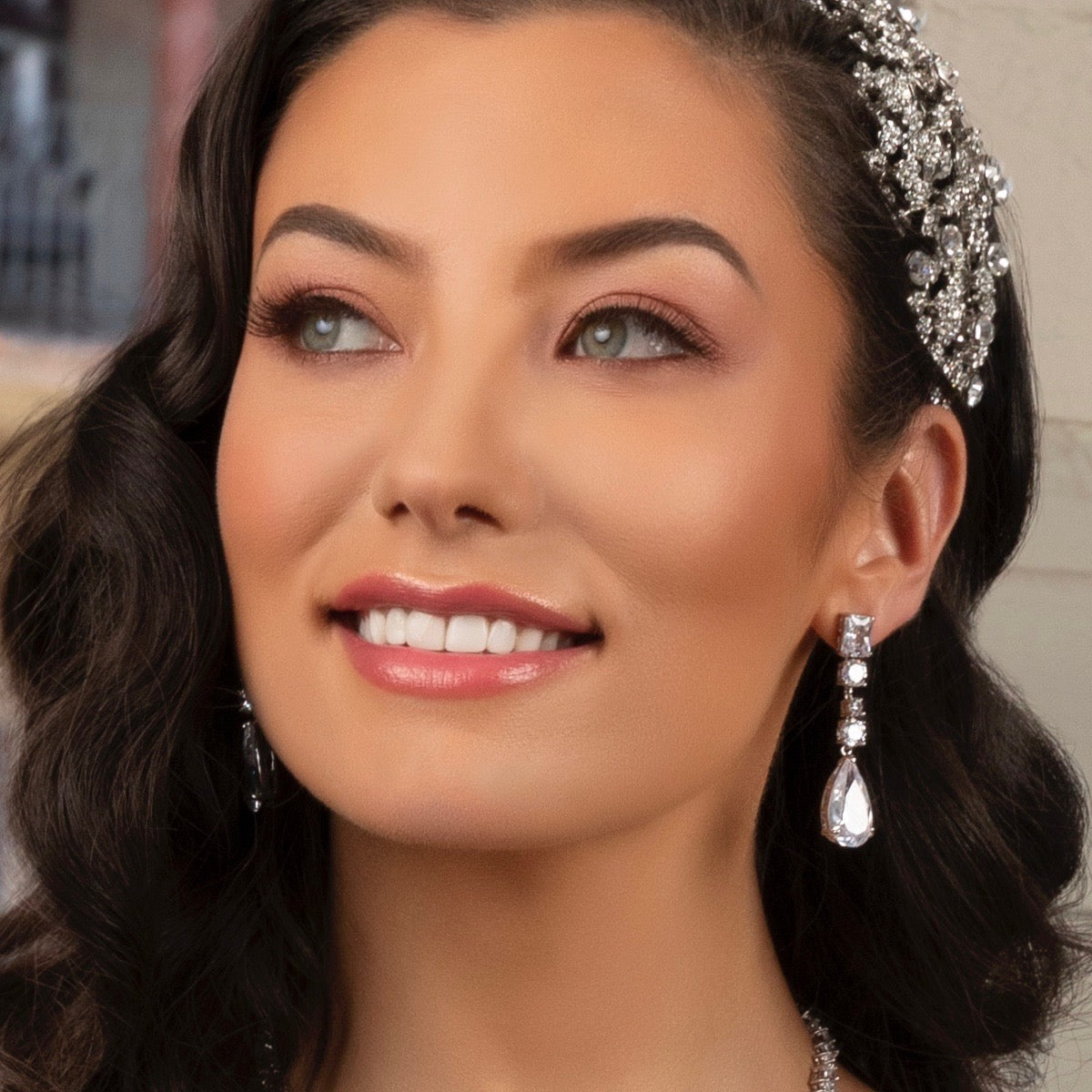 Brielle Linear Dangle Earrings on a model showing her gorgeous face.