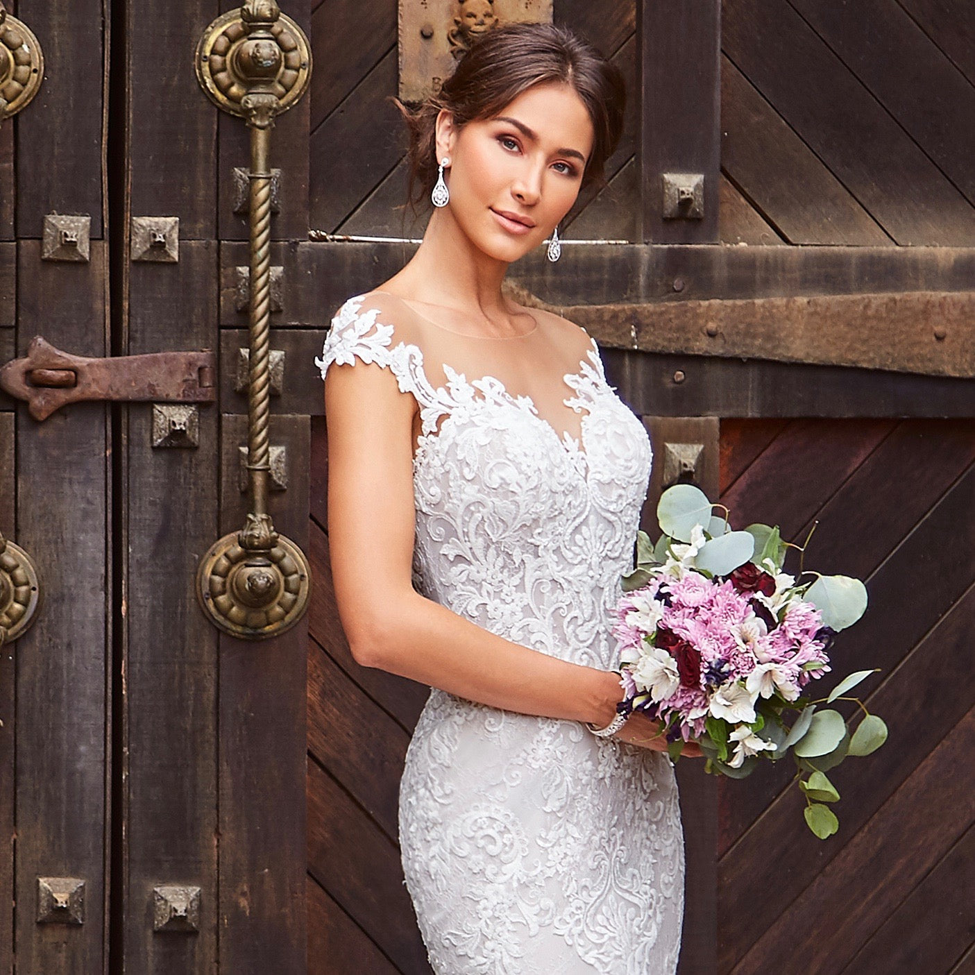 Guenevere Crystal Statement Earrings on a Model Bride wearing a Kitty Chen Couture Bridal Gown.