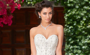 A happy bride wearing a bridal necklace from Anna Bellagio.