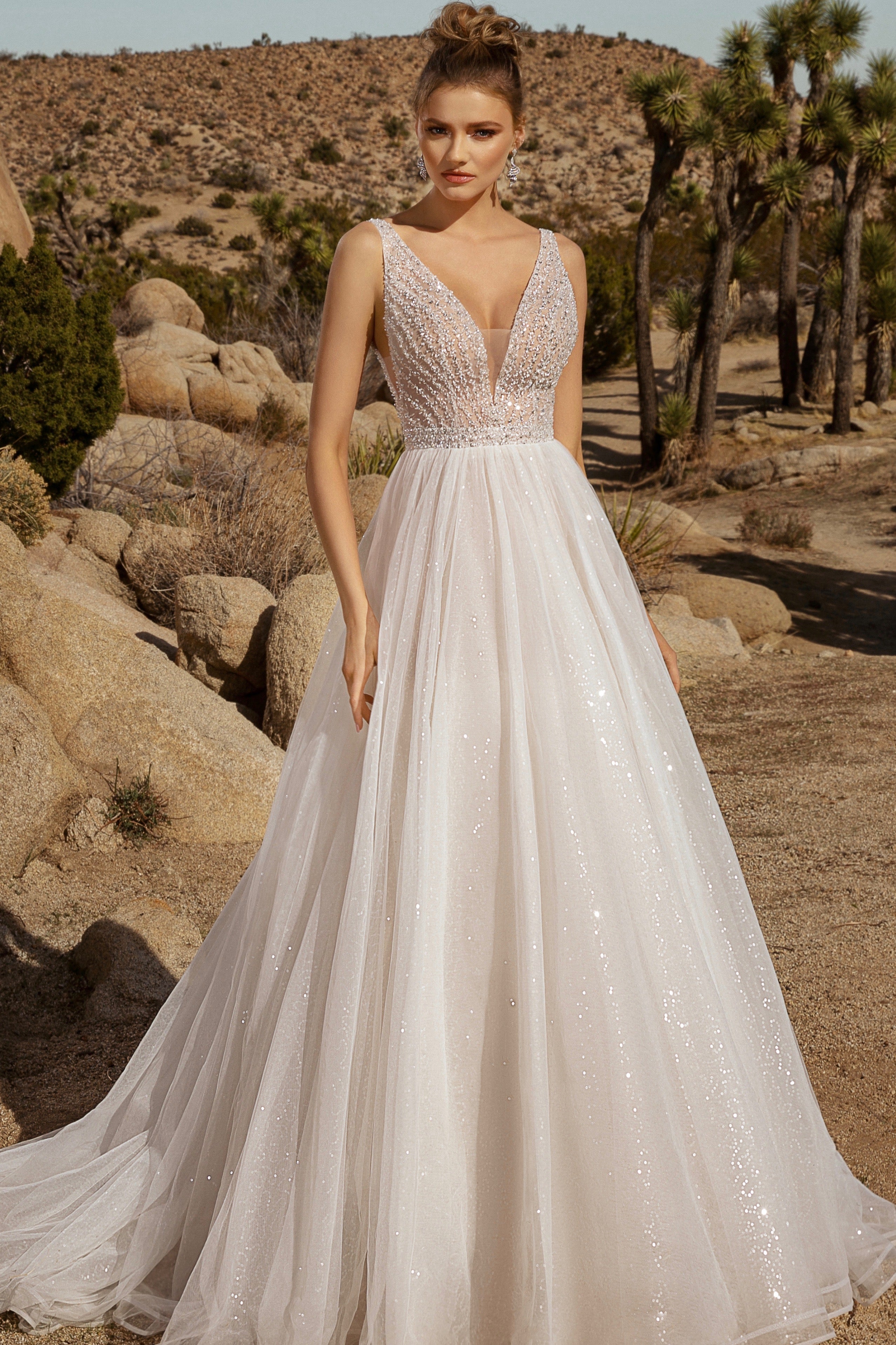 Charlameine Tassel Statement Earrings on Model in the Desert wearing a Kitty Chen Couture Bridal Gown. 