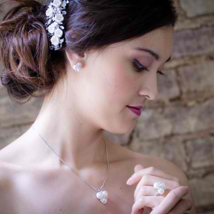 Emaline Pearl and Crystal Earrings on a Model.